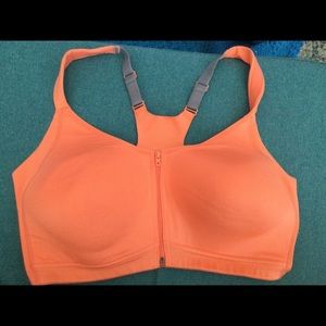 This bra was never worn. It is bright orange with adjustable straps.